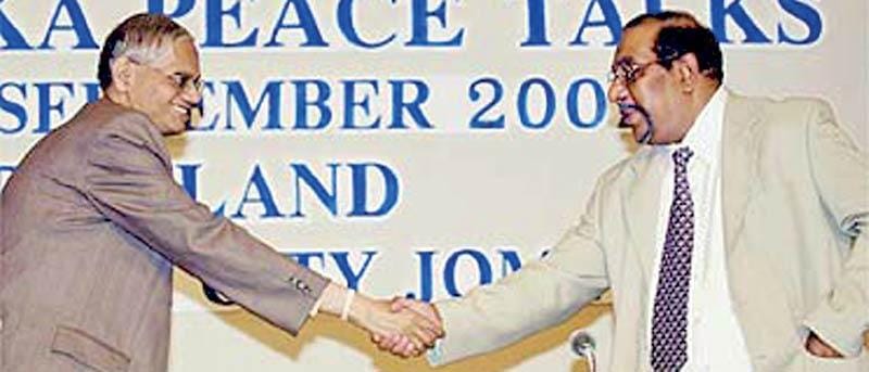 Prof. G. L. Peiris (left), the Sri Lankan government’s chief negotiator, with LTTE chief negotiator and political strategist Anton Balasingham.