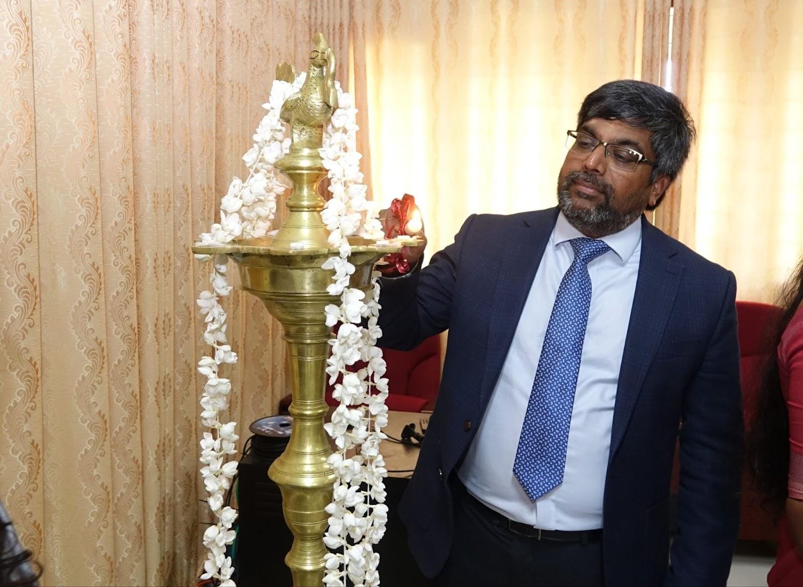 Professor Nishan Canagarajah lighting the traditional oil lamp at an event held at the Jaffna Medical Faculty.