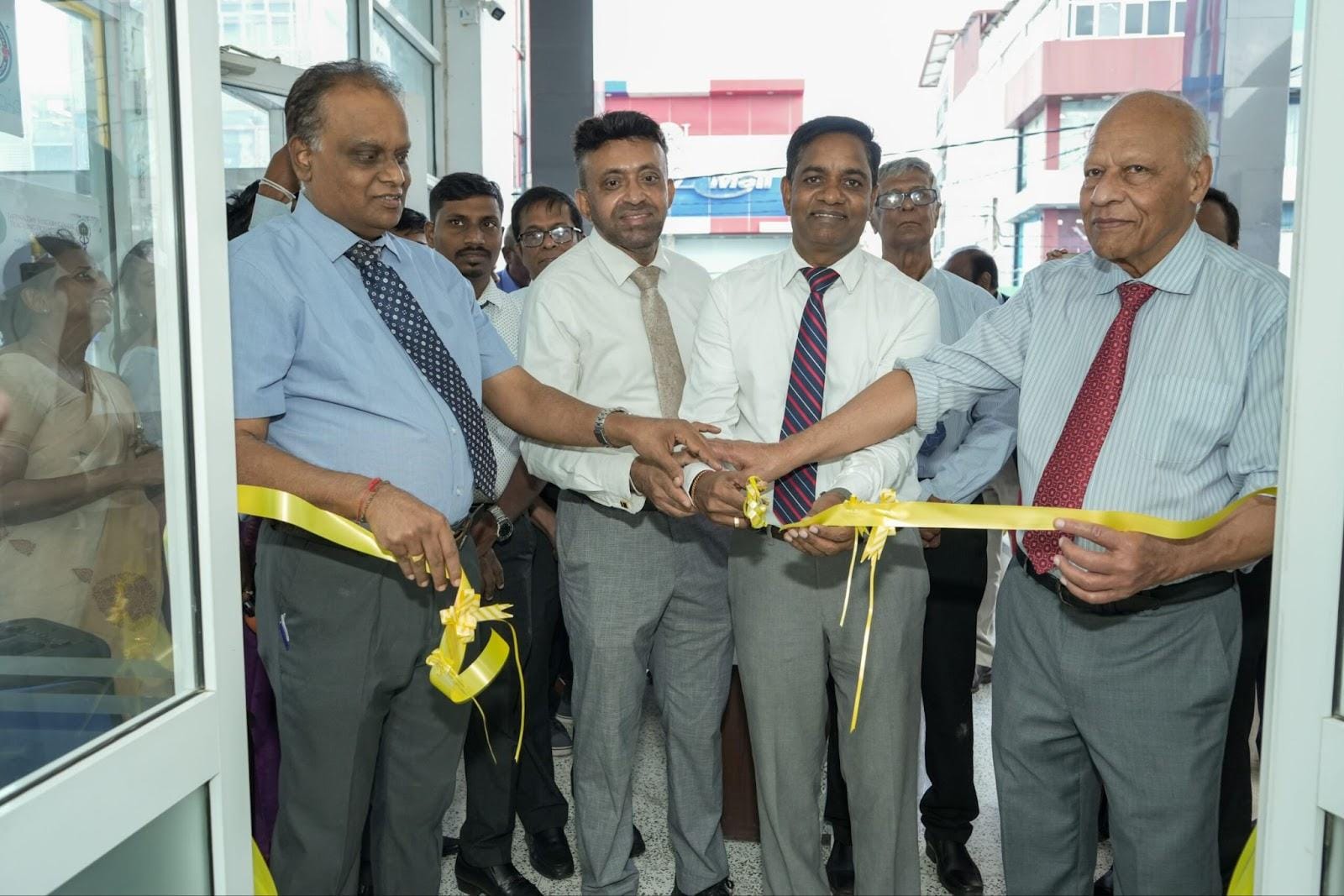 The ceremonial ribbon is cut by Dr. Arjuna Thilakarathne, Deputy Director General (Medical Services), Ministry of Health; Dr. T. Sathiyamoorthy, Director of Teaching Hospital Jaffna; Professor R. Surenthirakumaran; and Dr. Karunyan Arulanantham of IMHO–USA during the inauguration of the Jaffna Day Surgery Centre.