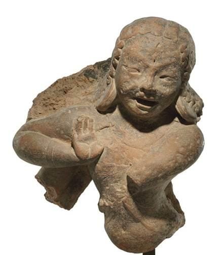 Perhaps one of the earliest expressions of the Dancing Shiva from the Gupta period. The image clearly illustrates a third eye – a characteristic signature of Shiva (red arrow) and the ‘Abayamudra’, the gesture of reassurance and safety (blue arrow), which dispels fear and accords divine protection and bliss in Hinduism. (From: A terracotta figure of a dancing Shiva , INDIA, GUPTA PERIOD, 5TH CENTURY | Christie's). This terracotta figure is currently held within a private collection and listed by the famous auction house - Christie’s of London