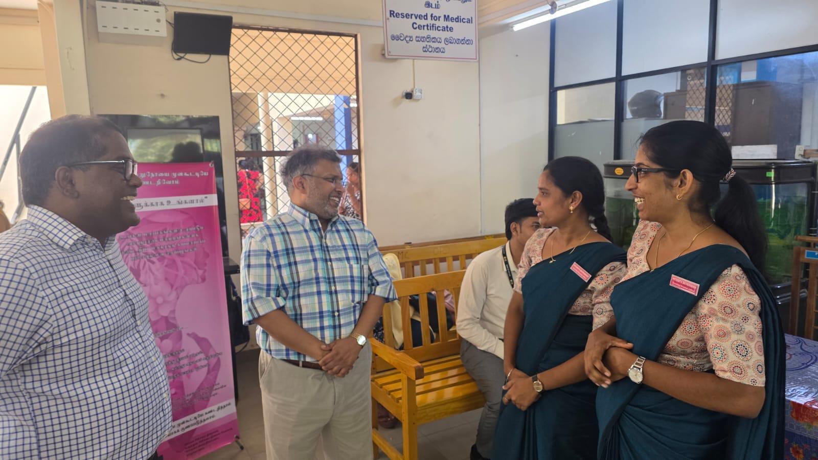 At Jaffna Teaching Hospital, Prof. Thavam Thampi Pillai (second from left) speaks with members of IMHO’s “befriender” programme—believed to be the first of its kind in Sri Lanka; also seen is Dr. Brammah (first from left), Specialist Nephrologist.