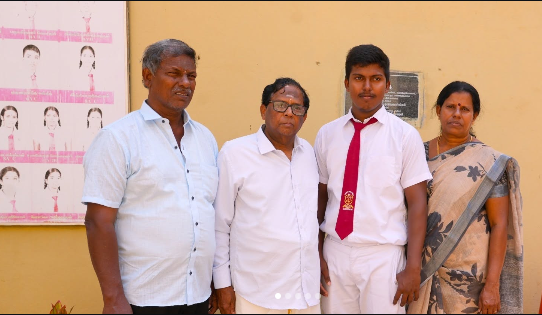 Theiventhiran Thirukumaran, third from left, stands with his parents and Northern Province Governor N. Vethanayagam, second from left, following the announcement of his island-first ranking in the Physical Science stream.