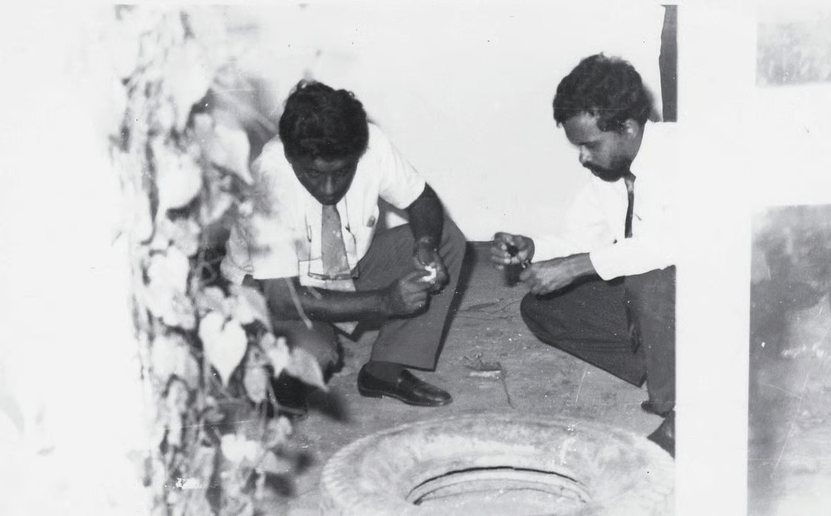 Two officers from Sri Lanka’s Department of Government Analyst examining bloodstains at the Batalanda Housing Scheme.